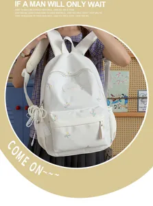Student canvas backpack with cute bow embroidery, large capacity school bag for girls.