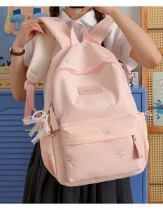 Pink student backpack detail view, cute bow embroidery and zipper pocket, daily school use.