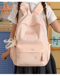 Cute pink student backpack with bow embroidery, large capacity daily school bag for girls.