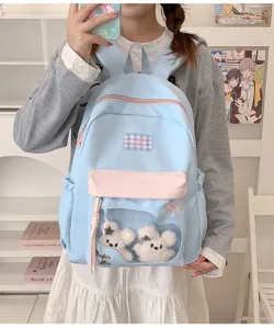 Sommerlicher, frischer Farbblock-Schülerrucksack mit transparentem Fach und Plüschbären für die Schule.