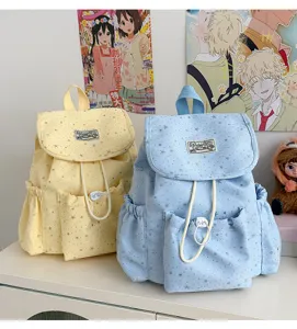 Detailed view of cute Japanese style canvas backpack with star print, casual student daypack.