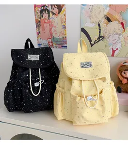 Detailed shot of Japanese sweet style star print canvas backpack with cute drawstring pocket.
