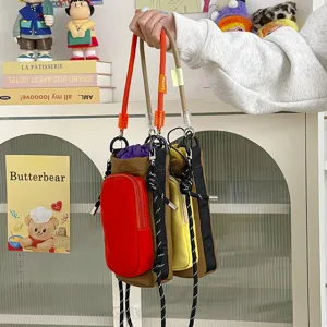 Portable color-blocked water bottle bag crossbody phone pouch for outdoor travel and daily wear.