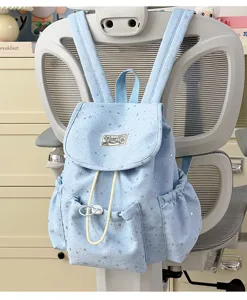 Light blue cute star pattern backpack detail, casual daily style, school book bag display.