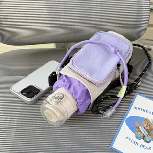 Water bottle crossbody bag detail showing color-block drawstring pocket and portable cup design.