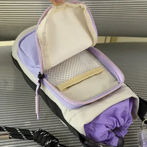 Detailed view of the multi-functional outdoor water bottle bag interior mesh pocket and zipper.