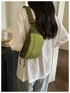 Detailed view of the stylish color-block crossbody chest bag for daily fashion wear.