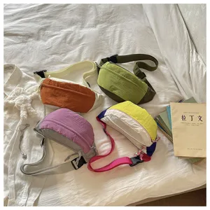 Detailed view of colorful dopamine crossbody fanny pack, vibrant contrast design street style.