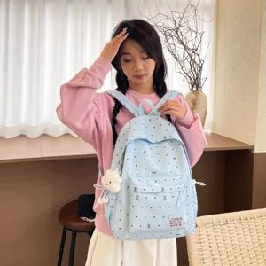 Sac à dos kawaii style japonais à pois et nœuds mignon pour école et usage quotidien.