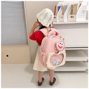 Pink cartoon children school bag detail, cute monster design backpack for kindergarten kids style.