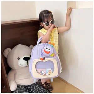 Detail view of cute purple cartoon kids backpack with clear window and fun bug pouch for school.
