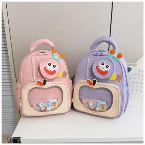 Cute cartoon school backpack for kids with clear front pocket, monster design, pink, purple.