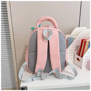 Pink kids school backpack back view detail, breathable mesh straps, cute cartoon style.