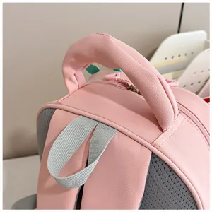 Pink kids school backpack top detail, cute cartoon toddler bookbag handle view display.