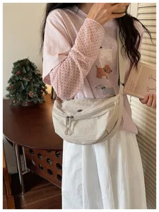 Lightweight nylon crescent crossbody bag for women, casual commuter dumpling shoulder bag.