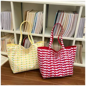 Large capacity canvas tote bag with trendy wave dot pattern for women daily casual use.