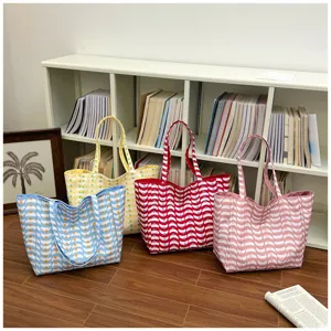 Detailed shot of fashionable large capacity wave print tote bag with versatile casual style.