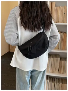 Black crescent dumpling bag for women, casual lightweight nylon crossbody shoulder bag.