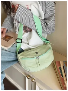Light green crescent shoulder bag for women, stylish casual nylon crossbody dumpling bag.