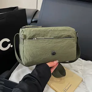 Casual nylon crossbody bag for women, multi-pocket design, green daily shoulder bag.