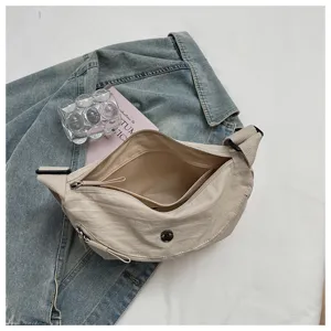 Casual solid nylon dumpling shoulder bag, minimalist daily crossbody bag with zip closure.
