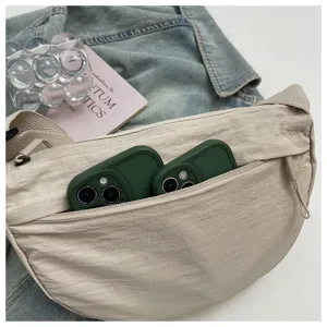 Minimalist nylon crescent shoulder bag, casual everyday dumpling crossbody bag detail view.