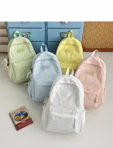 Cute bow embroidered canvas backpack for school girls, fresh pastel colors, large capacity daily bag.