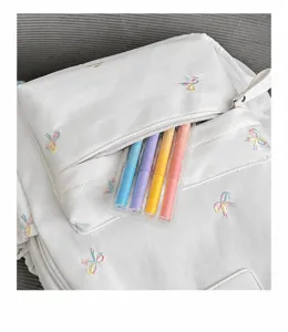 Cute bow embroidery student backpack front pocket detail view stylish school book bag