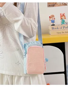 Detailed view of lightweight color-block crossbody water bottle bag with front zipper pocket.