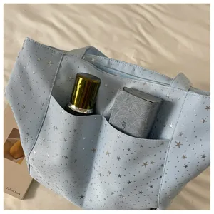 Light blue star print tote bag, stylish large capacity casual shoulder handbag for women.