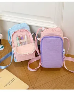Lightweight color-block water bottle crossbody bag, casual outdoor phone and cup holder.