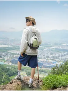 Outdoor hiking scene detail of the lightweight waterproof chest backpack featuring utility.