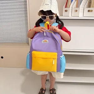 Kids colorful school backpack with front pocket and contrast color design for daily travel use.
