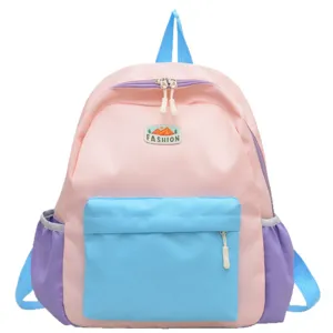 Colorblocked kids backpack for school and travel, cute pink and blue design with front pocket.