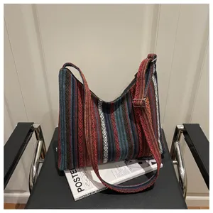 Ethnic striped canvas shoulder bag, casual woven hobo crossbody bag detailed view.