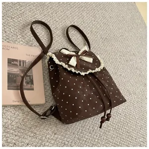 Sweet vintage polka dot backpack for women with cute lace trim and bows, casual daily bag.