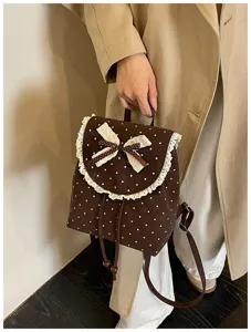 Sweet retro Korean style brown polka dot backpack featuring delicate lace trim and cute bow.