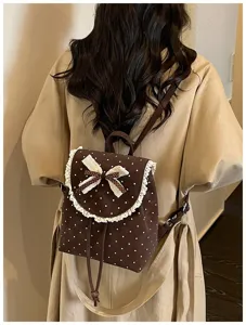 Sweet style brown polka dot backpack with lace trim and bow detail for daily wear.