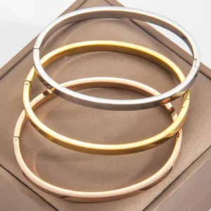 Minimalist smooth stainless steel bracelet detail view, elegant metal cuff for daily wear.