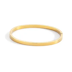 Minimalist gold-plated stainless steel smooth flat bangle bracelet for daily wear.