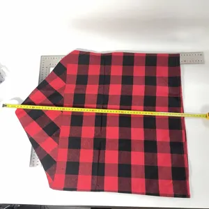 Red and black buffalo plaid Christmas chair cover and table runner for holiday party decor.