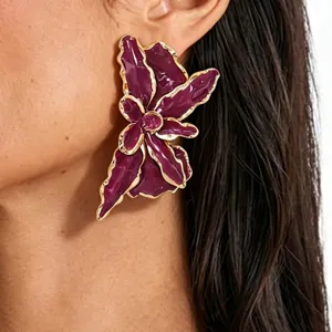 Exaggerated purple flower earrings with gold trim, bold statement vacation jewelry.
