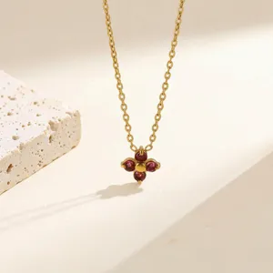 Elegant gold stainless steel four leaf clover red gemstone pendant necklace for women.
