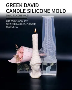 Close-up detail of David silicone candle mold and finished statue prop, perfect for crafts.