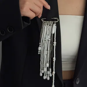 Stylish imitation pearl beaded tassel safety pin brooch for women clothing detail view.