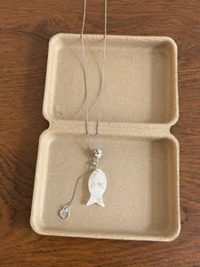 Crystal fish pendant necklace with stone bead and adjustable chain detail for daily wear.