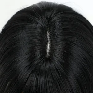 Close-up detail of black wig scalp and parting line showing natural simulation design.