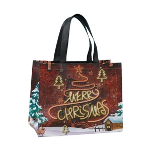 Vue détaillée du sac de shopping de Noël en non-tissé épais avec impression festive.