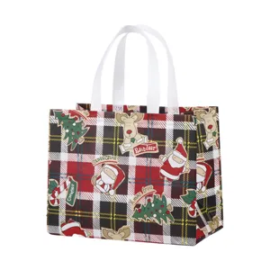 Vue détaillée du sac cabas de Noël en intissé, motif écossais et éléments festifs.