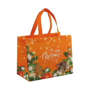 Sac cabas de Noël en intissé orange avec motif festif d'arbre et de maison en pain d'épices.
